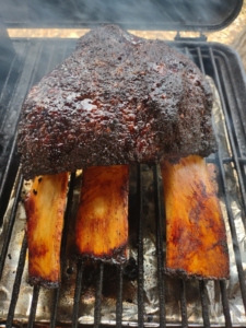 Texas beef short ribs on a smoker.