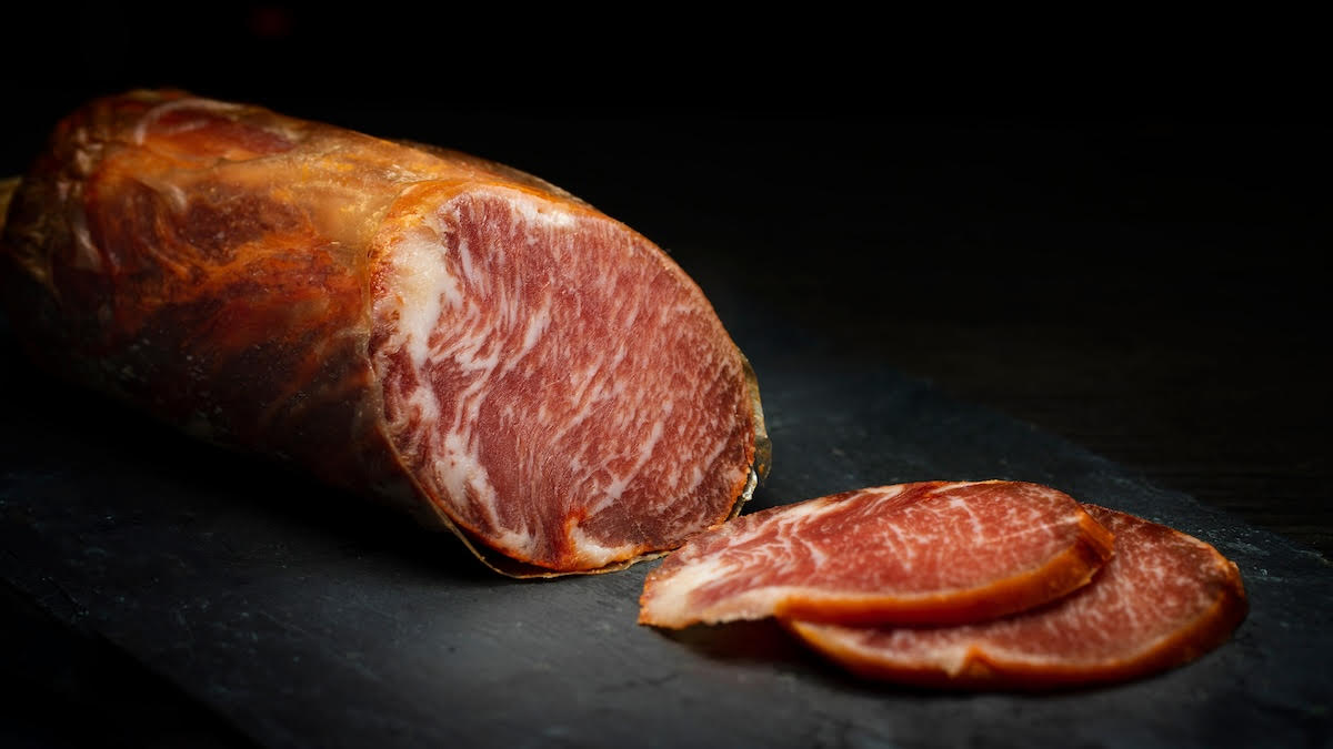 Sliced Spanish lomo cured pork tenderloin.