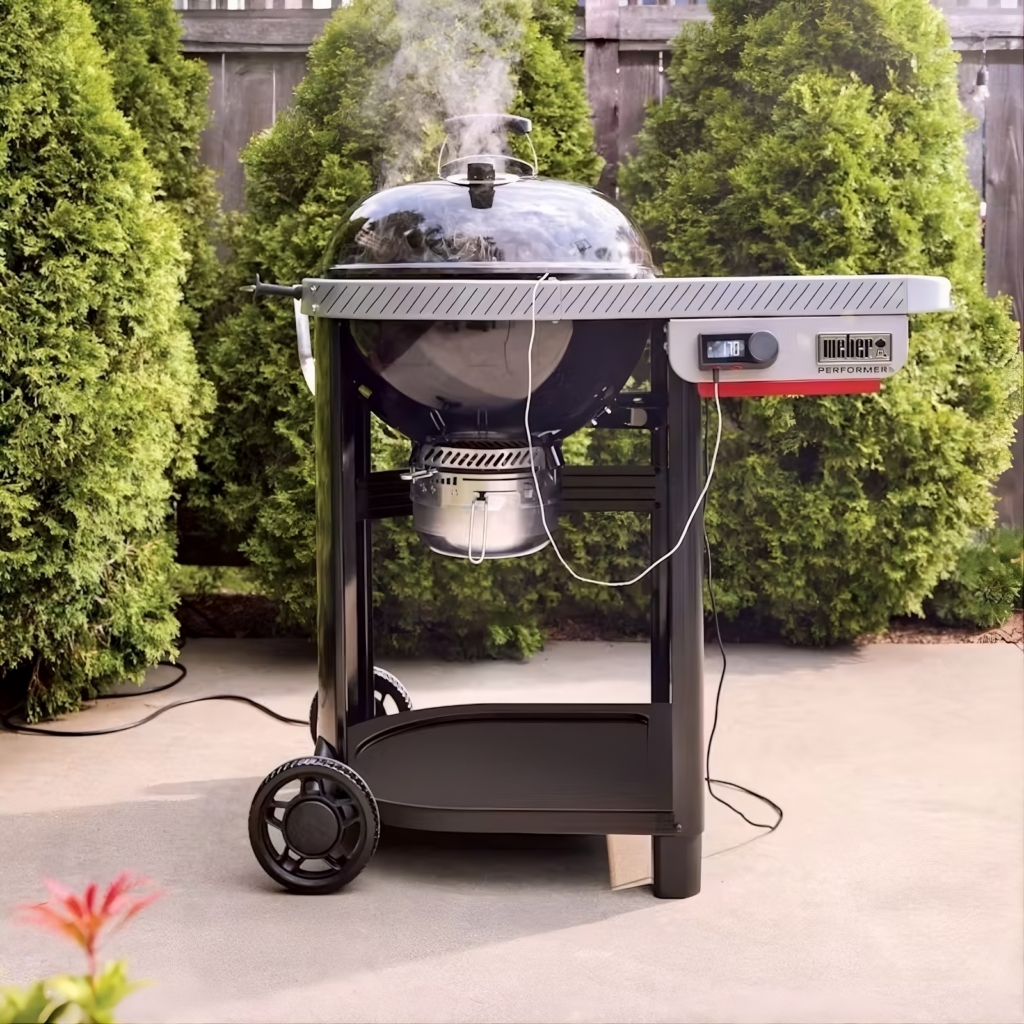 Weber 22-inch Performer Smart Charcoal Grill shown from the front and plugged in.