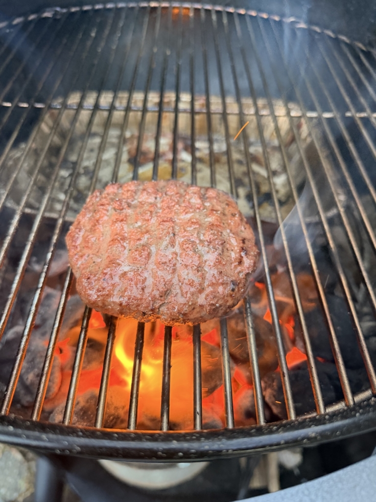 Reverse-seared burger on a Weber 22" Performer Smart Charcoal Grill.