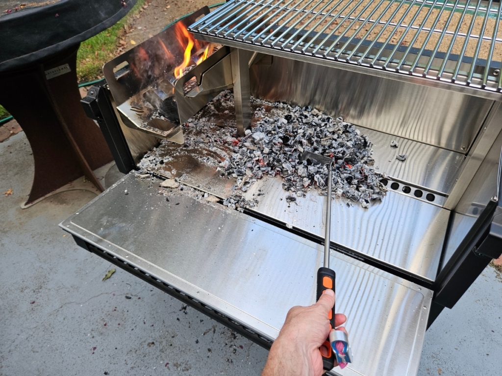 Moving coals with coal rake.