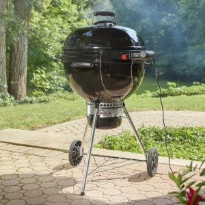 Weber Kettle Smart Ring shown on a Weber kettle grill on a patio.